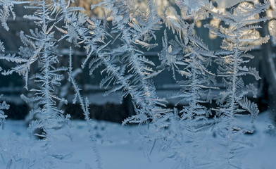 beautiful frosty patterns on glass