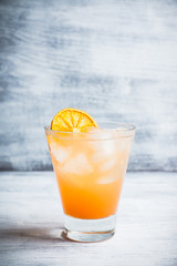 Fresh cocktail with grapefruits on the rustic background. Selective focus. Shallow depth of field.