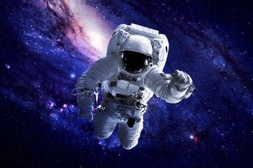 Obraz na płótnie Canvas Astronaut in Space - Elements of this Image Furnished by NASA