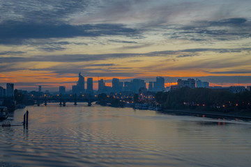 Paris, France - 11 04 2018: View of the towers of La Défense district from the Clichy bridge at sunset