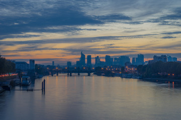 Paris, France - 11 04 2018: View of the towers of La D&eacute;fense district from the Clichy bridge at sunset