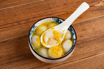 traditional Chinese sweet dumplings with some chrysanthemum