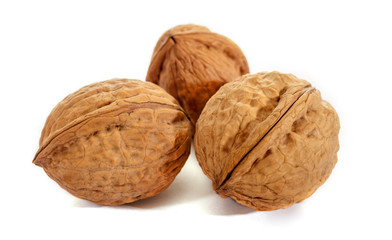 Walnut on white background. Raw walnut. The texture of the shell.
