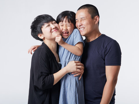 Asian portrait, family photo. Indoors white background