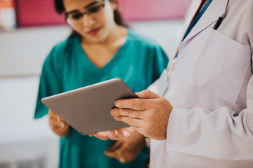 Doctor and nurse discussing a medical case
