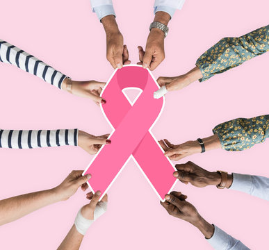People holding a breast cancer awareness ribbon