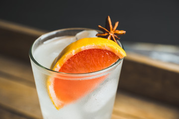 Fresh cocktail with grapefruits on the rustic background. Selective focus. Shallow depth of field..