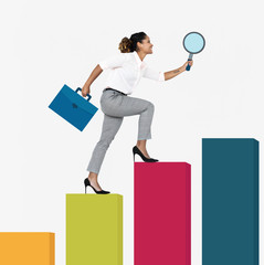 Woman walking up a graph with a magnifying glass