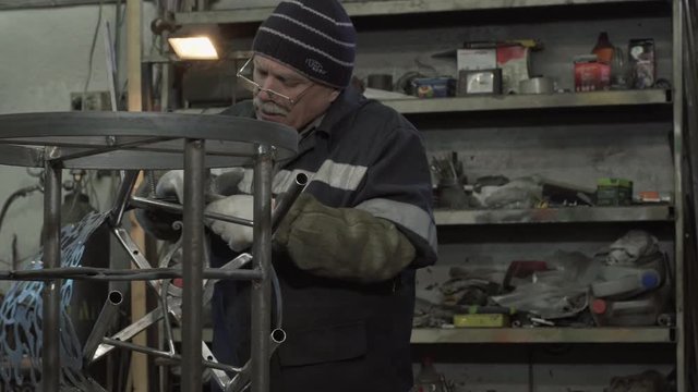 Male Blacksmith Is Working On His New Forged Products