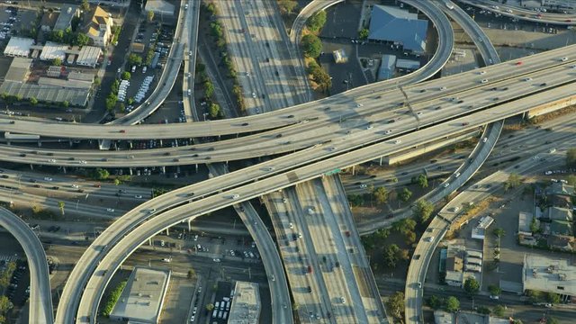 Aerial view freeway interchange vehicles travelling around LA