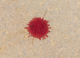 Blood drops on the pavement as background
