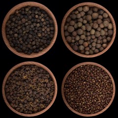 set of peppercorns isolated on black background