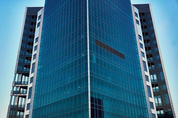 Fototapeta premium modern skyscraper with panoramic blue Windows
