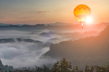 Hot Balloon, Sunrise and fog in the morning, Thailand.