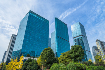 modern office building with green trees.