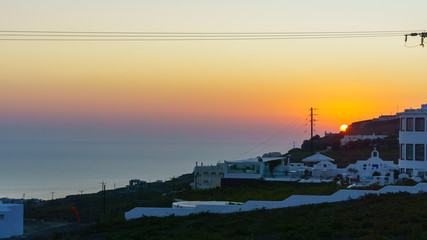 Fototapeta premium Beautiful Sunrise landscape with white architecture on Santorini island, Greece.