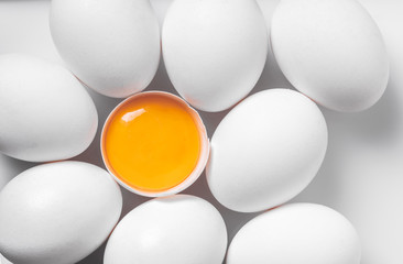 broken and whole chicken eggs