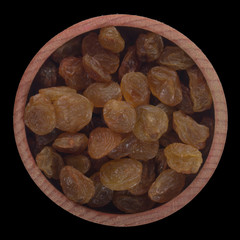 raisins in wooden cup isolated on black background. top view