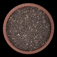 chia seeds in wooden cup isolated on black background. top view