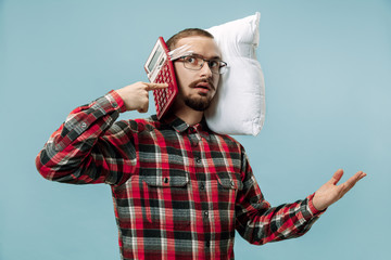 Tired man sleeping at home or office having too much work. Bored businessman with pillow and calculator. Overworked and tired man. The busy, boring, worried, concerned, sleep day, introuble concept