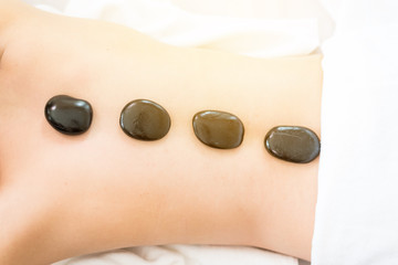 closed up back body,Young healthy asian woman lying relax in spa salon.Traditional Thai oriental aromatherapy and Massage beauty treatments.Recreation vitality wellness wellbeing resort hotel