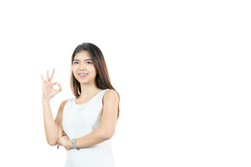 Closed up portrait of cheerful happy excited asian woman wearing a white casual and showing ok sign with beaming smile, clean skin and smooth straight black hair. isolated on white background