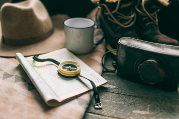 vintage camera hat and rustic-style plaid on a dark background vintage stuff and old compass things...