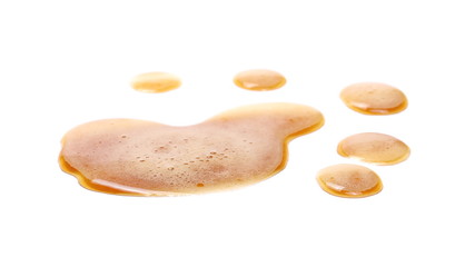 Spilled beer puddle with foam isolated on white background and texture