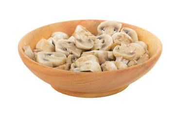 heap of champignons in wooden plate isolated on white background