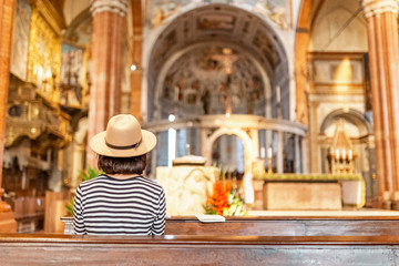 Asian Woman praying in church