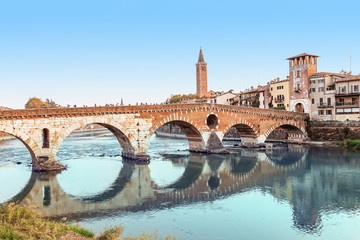 Panoramic cityscape view of Verona old town and bridge over Adige river. Travel destination in Italy concept