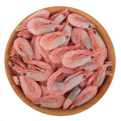 heap of prawns in wooden plate isolated on white background. top view