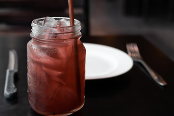 Juice with White plate on table
