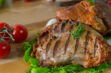 Tasty grilled meat with dill and tomatoes