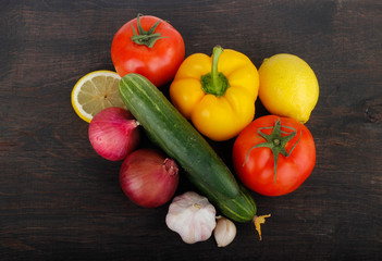 meat with vegetables on wooden background. top view