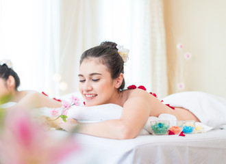 Obraz na płótnie Canvas Young healthy asian woman lying relax in spa salon.Traditional Thai oriental aromatherapy and Massage beauty treatments.Recreation vitality wellness wellbeing resort hotel lifestyle leisure.copy space