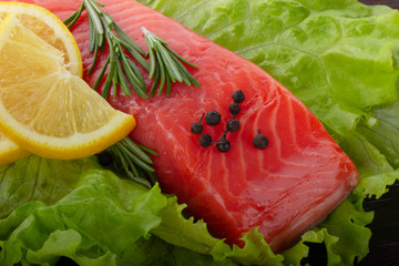 slice of salmon with spices background