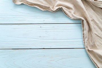 kitchen cloth (napkin) on blue wooden background