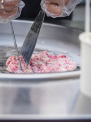 Thailand stir-fried ice cream rolls at freeze pan. Organic natural rolled ice cream hand made dessert