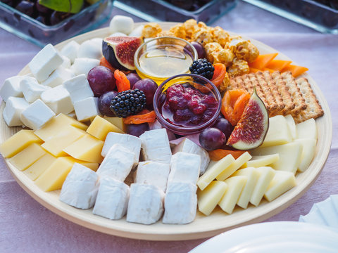 Fruit plates furshet on tables with drinks