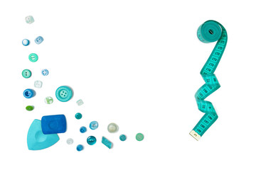 Set of Sewing accessories (a centimetric measuring tape, a set of buttons, swept  for fabric) on the white isolated background. The place for a text inscription