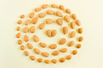 Creative and minimalist composition layout of almonds nuts. Concept- healthy lifestyle, vegetarianism, raw food, vegetable protein.