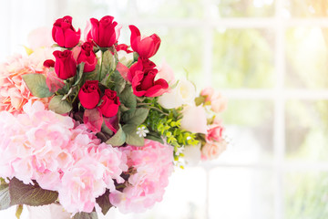 Beautiful pink- red roses flowers bouquet in vase on bride and groom table.Valentine day and romantic couple love concept .copy space