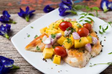 Clean food, Grilled chicken breasts , mango , tomato and vegetables.