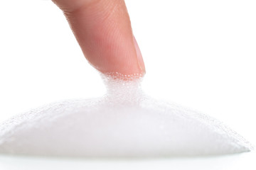 White foam bubbles texture with child finger and hand  isolated on white