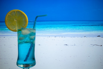 Blue Lagoon cocktail in highball glass with a straw