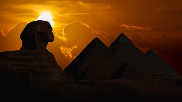 Egypt: The Great Pyramids Of Giza and Sphinx at Sunset, Time Lapse with Red Sun and Clouds, Cairo
