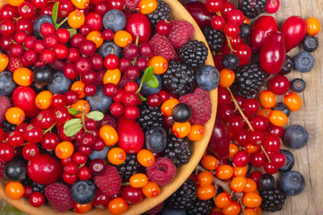 heap of berriers on wooden background