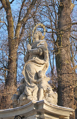 old religious statue in the forest in winter, Hukvaldy, Czech Republic