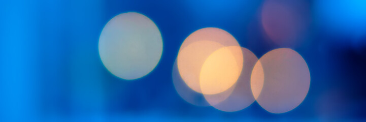 light colored spots of night illumination, urban environment. Banner for design.